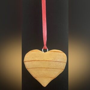 Visual Bliss Co Hand Crafted Wooden Heart Ornament with Red Ribbon. 
Artist:TKE